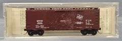 Ten Kadee Micro-Trains N Scale Box cars in Clear Cases