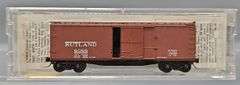 Ten Kadee Micro-Trains N Scale Box cars in Clear Cases
