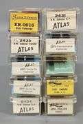 Ten Atlas N Scale Cabooses in Clear Cases