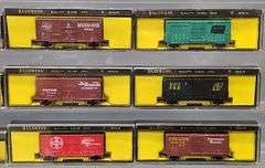 Twenty-seven Bachmann N Scale Freight Cars with one Diesel Locomotive in Clear Cases
