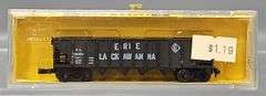 Eight AHM Minitrains N Scale Open Hopper Cars in Clear Cases