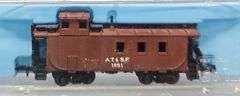 Ten Atlas N Scale Cabooses in Clear Cases