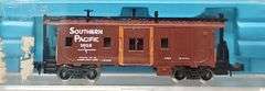 Ten Atlas N Scale Cabooses in Clear Cases