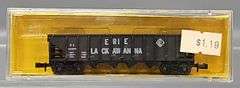 Eight AHM Minitrains N Scale Open Hopper Cars in Clear Cases