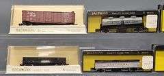 Twenty-seven Bachmann N Scale Freight Cars with one Diesel Locomotive in Clear Cases