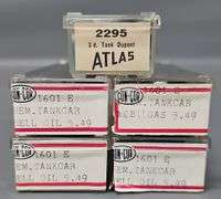 Four Kato and one Atlas N Scale Tank Cars in Clear Cases