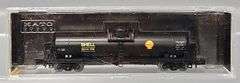 Four Kato and one Atlas N Scale Tank Cars in Clear Cases