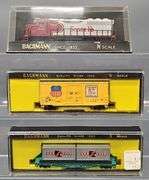 Twenty-seven Bachmann N Scale Freight Cars with one Diesel Locomotive in Clear Cases