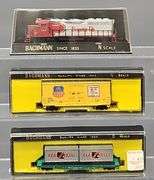 Twenty-seven Bachmann N Scale Freight Cars with one Diesel Locomotive in Clear Cases