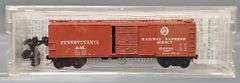 Ten Kadee Micro-Trains N Scale Box cars in Clear Cases