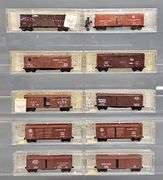 Ten Kadee Micro-Trains N Scale Box cars in Clear Cases