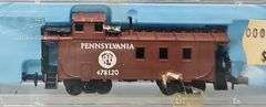 Ten Atlas N Scale Cabooses in Clear Cases