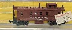 Ten Atlas N Scale Cabooses in Clear Cases