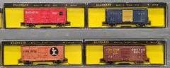 Twenty-seven Bachmann N Scale Freight Cars with one Diesel Locomotive in Clear Cases