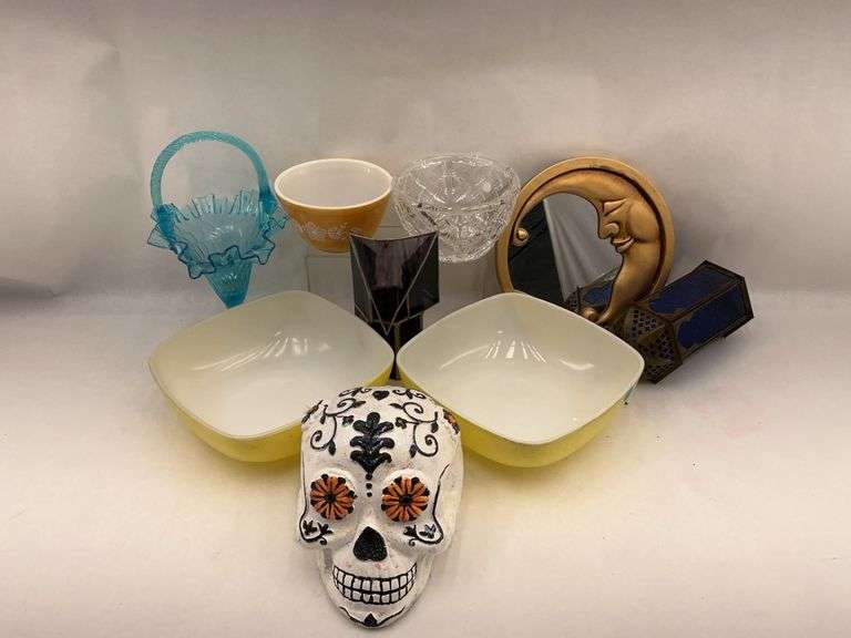 Assorted Household and Decorative Items Including Pyrex Bowls, Glassware, Skull Decor, and Mirror image