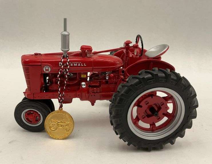 Red McCormick Farmall Model Tractor with Medal Ornament image