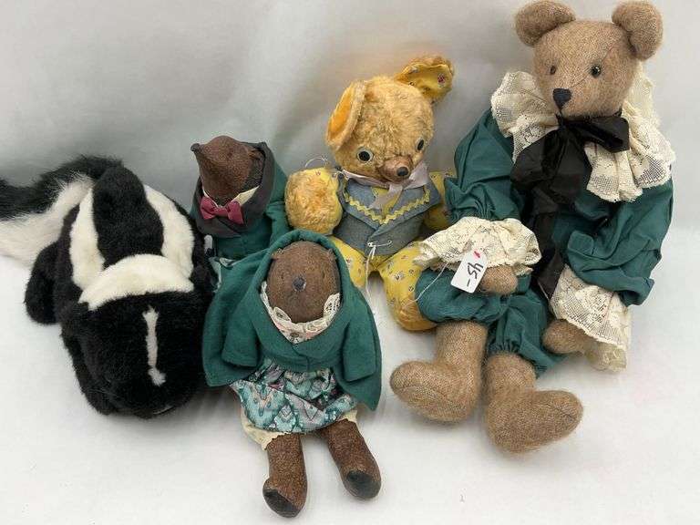 Collection of Plush Animals: Teddy Bears, Skunk, and More image