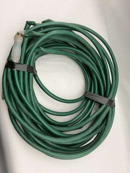 Coiled Green Garden Hose image