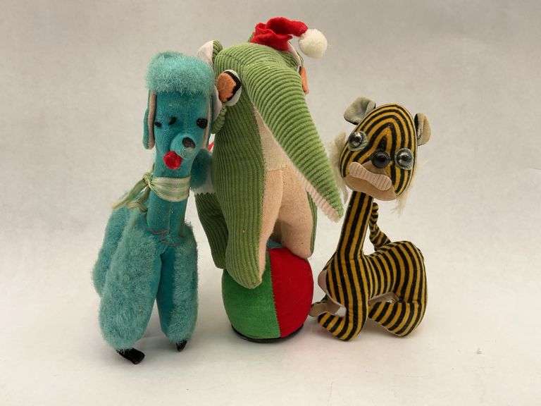 Three Plush Animals - Elephant, Poodle, and Striped Creature image