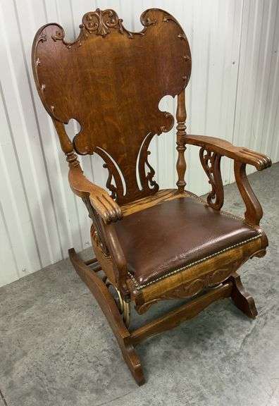 Antique Victorian Platform Ornate Wood Rocking Chair with Craved Details and Brown Leather Seat image