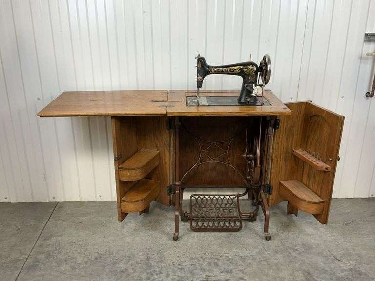 Antique Free Treadle Sewing Machine in Quarter Sawn Oak Cabinet image