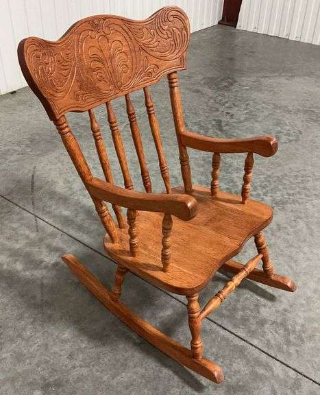 Antique Hand Carved Oak Rocking Chair with Ornate Pressed Back image