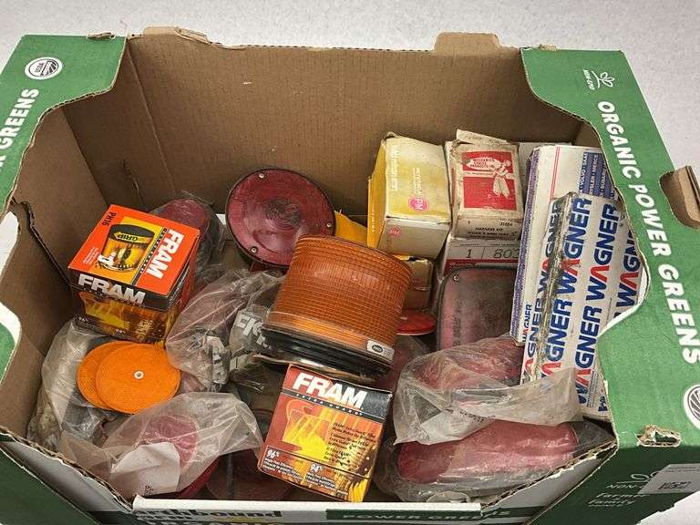 Assorted Auto Parts - FRAM Oil Filters, Wagner Bulbs, and Various Lights