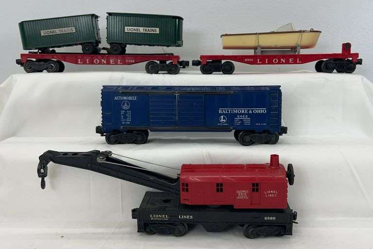 Postwar Lionel O Gauge 6801 Airplane, 3460 trailer vans, 6468 Automobiles, 6560 operating crane image