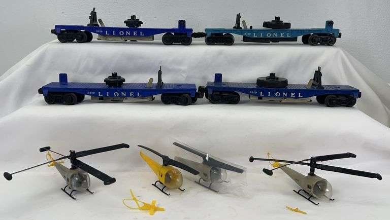 Four postwar Lionel O Gauge 3419 helicopter launching cars with variations and helicopters image