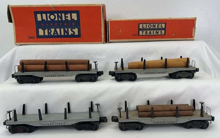 Postwar Lionel O Gauge two 2411 and two 6411 flat cars two boxes ten logs image