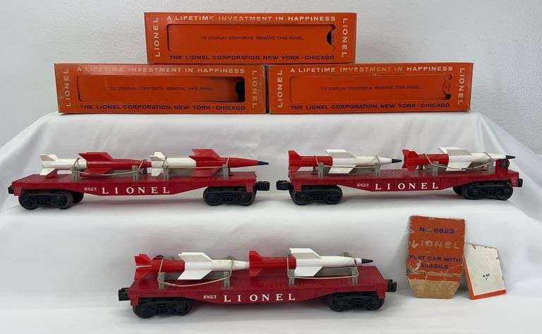 Three postwar Lionel O Gauge 6823 Flat Car with Missile in original box image