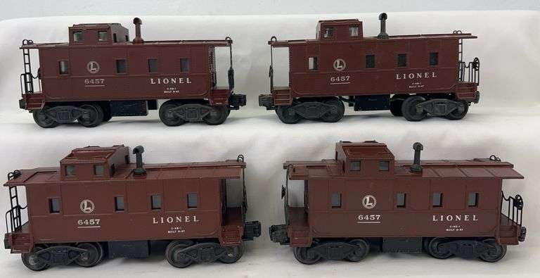 Postwar Lionel O Gauge four 6457 illuminated caboose, one painted chimney image