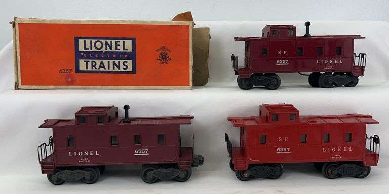 Three variations of postwar Lionel O Gauge 6357 illuminated cabooses w/one box image