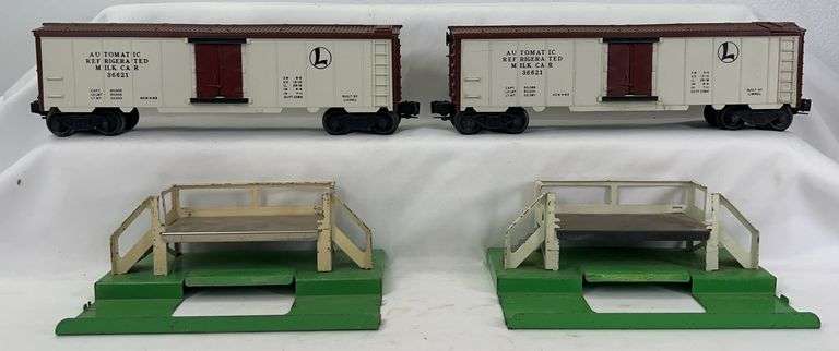 Postwar Lionel O Gauge two 3662 milk cars with two 3462P milk platforms image