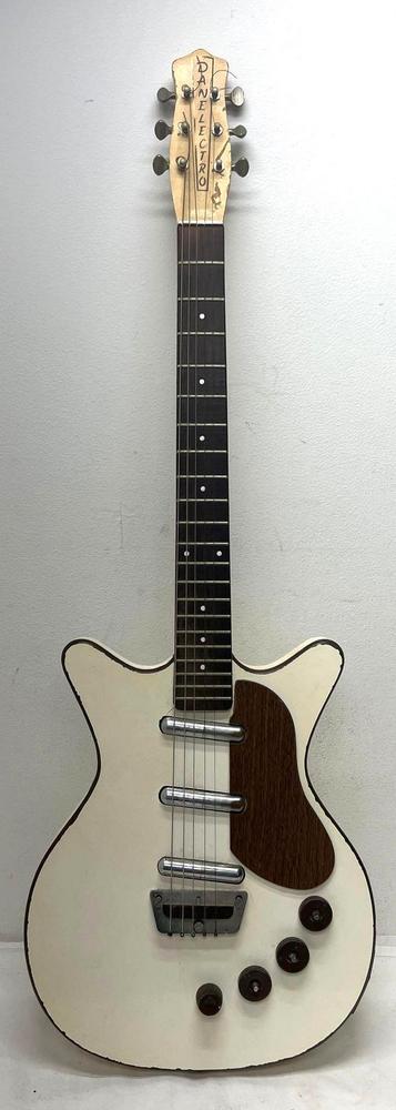 Danelectro 6-string electric guitar 3-pickup Deluxe?