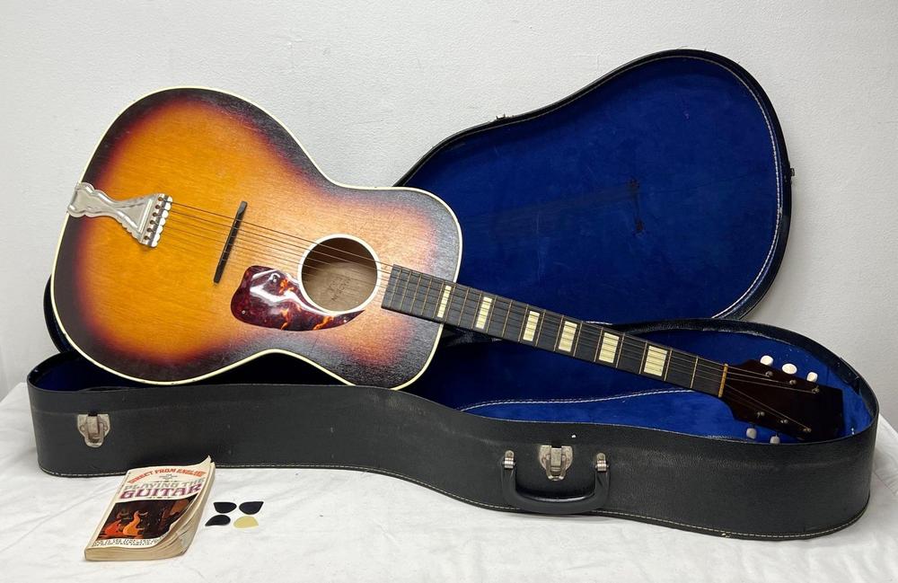 Older wooden acoustic guitar Made In U.S.A. Sunburst