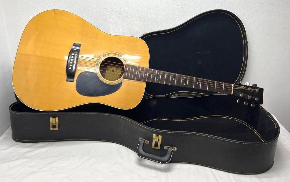 Blonde 6-string acoustic guitar in hard case