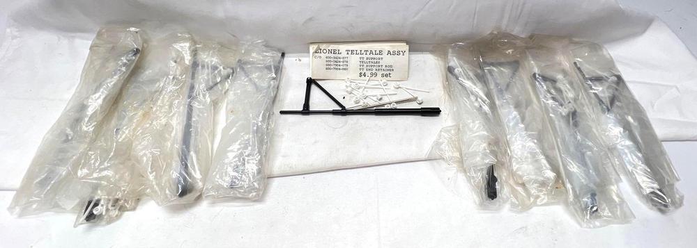 Nine Modern Era Lionel O Gauge telltale assemblies black and white