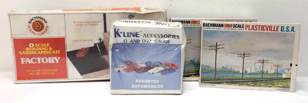Three Plasticville one K-Line building kits autos