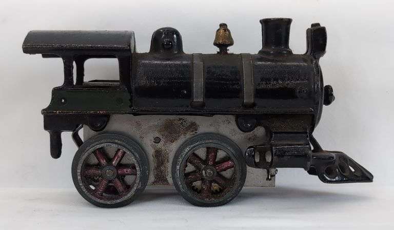 Prewar cast Iron O Gauge key wind steam locomotive with snap in motor
