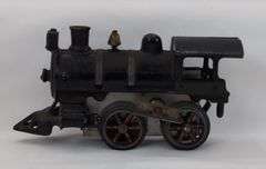 Prewar cast Iron O Gauge key wind steam locomotive with snap in motor
