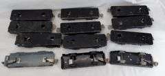 Twenty-five Marx O Gauge flat cars, pipe/log cars, chassis olive drab