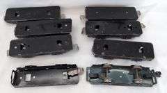 Twenty-five Marx O Gauge flat cars, pipe/log cars, chassis olive drab