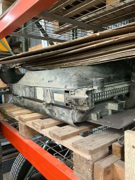 Shelf of Various Items - Coolant Reservoir, Hydraulic Fluid, Wheeled Machine