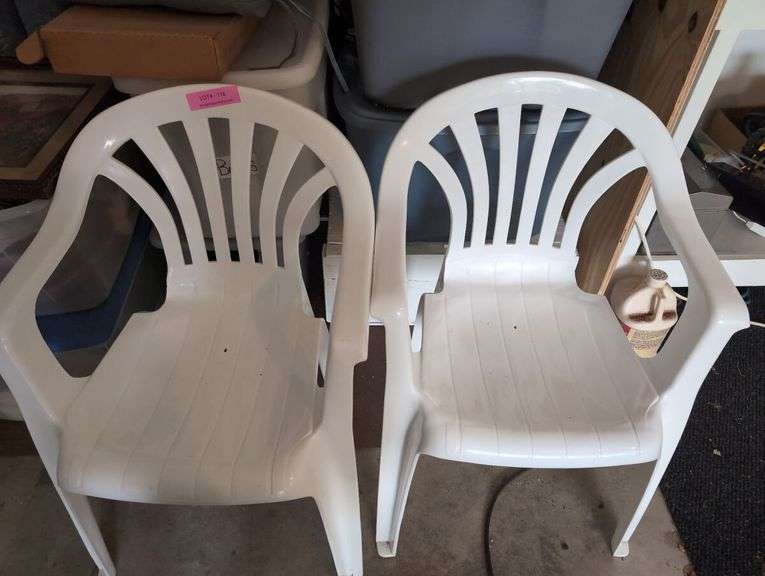 Nine totes of assorted household miscellaneous and two plastic stacking chairs
