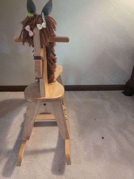 Potted Plants and Wooden Rocking Horse