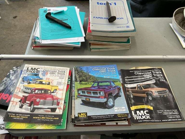 Chevrolet & GMC Truck Parts, Manuals, and Hubcaps Lot image
