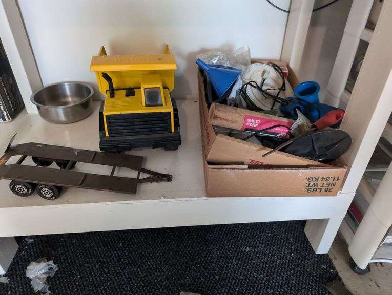 Contents of workbench, barn, lantern, ground clear, air station, toolbox, Tonka trucks, and more