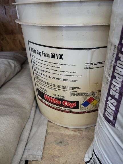 Assorted Construction Materials: Sand, Acetone, and Form Oil