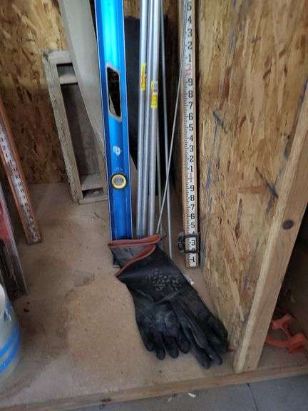 Building and Construction Tool Lot: Empire Level, Conduit, Measuring Stick, and More